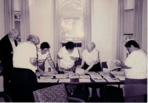 Members compiling documents in preparation for filing a shareholder resolution